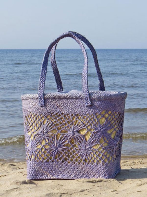 8. The basket-bag has an outside of lace patterned plaited raffia. For shape and carrying strength, the basket bag has an inside of braided sedges. It has a drawstring closure of cotton textile. Click below to find it is La Maison Afrique FAIR TRADE assortment.